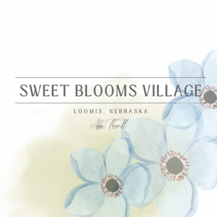 Sweet Blooms Village logo with blue watercolor flowers and soft pastel background.